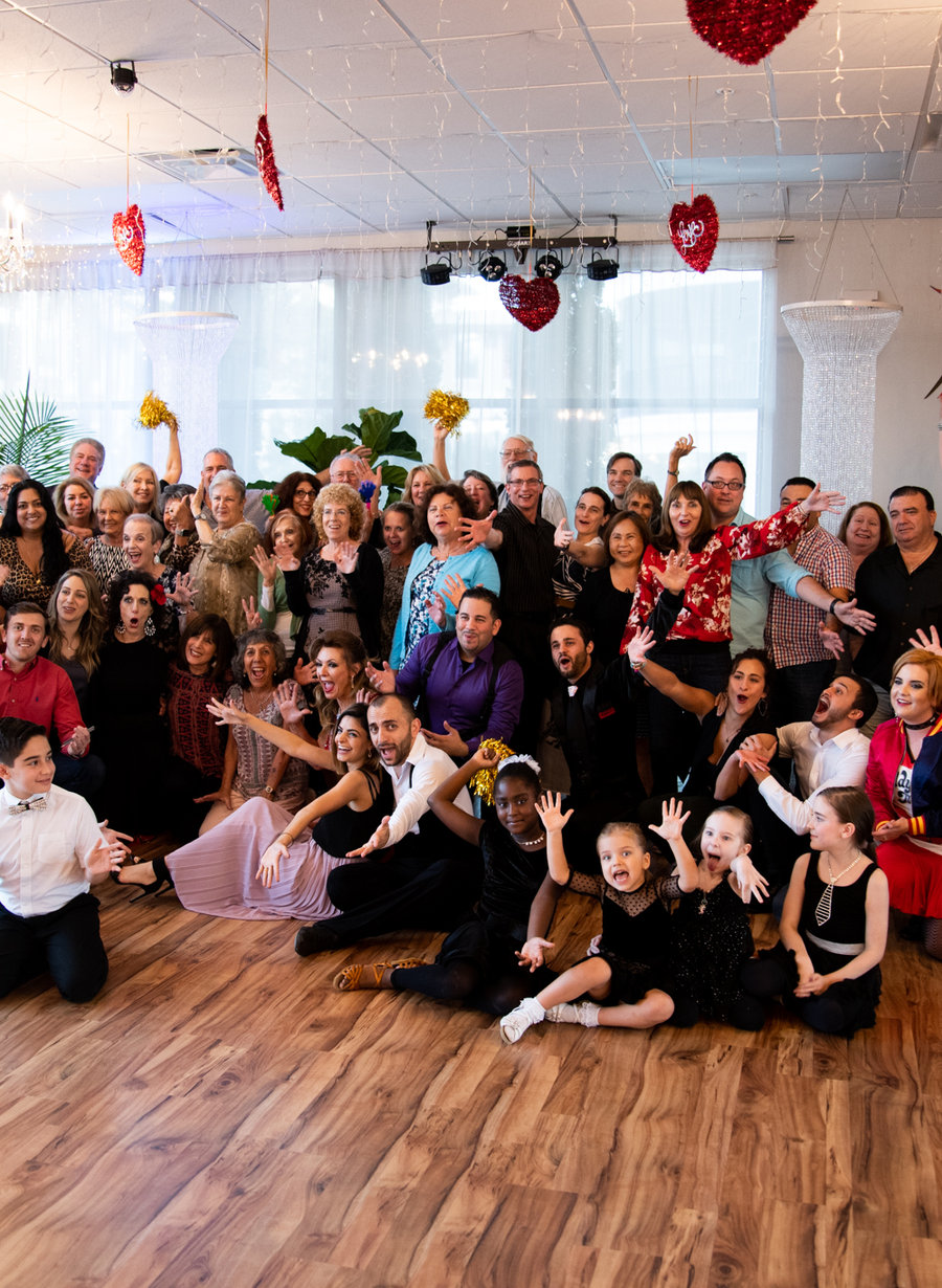 Students, instructors and staff of VM Ballroom Dance Studios gathered together on the studio floor