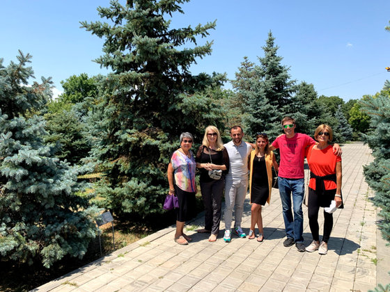 Three of the group on the spruce-lined walk
